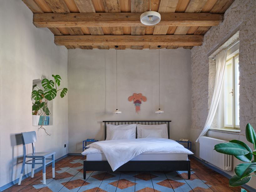 reclaimed materials and handcrafted finishes reshape historic townhouse in czech republic - 8