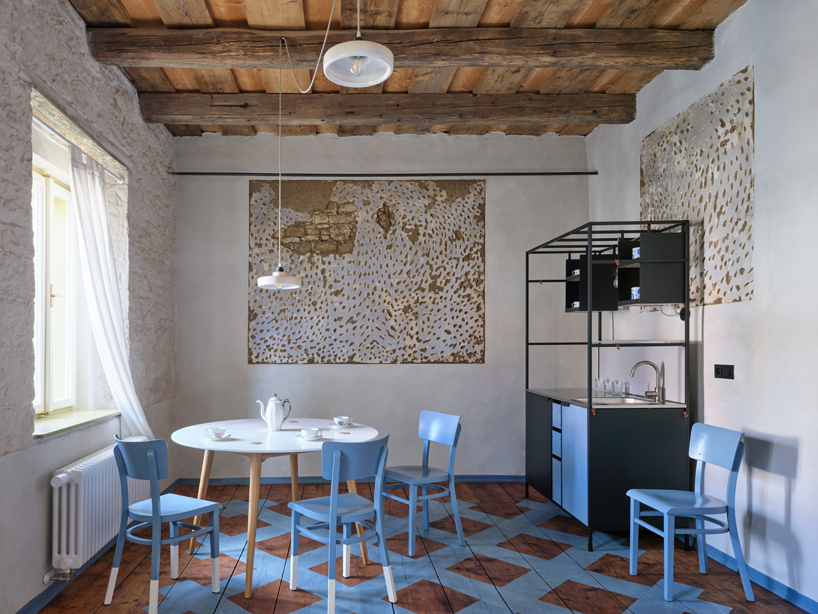 reclaimed materials and handcrafted finishes reshape historic townhouse in czech republic - 7