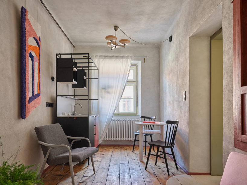 reclaimed materials and handcrafted finishes reshape historic townhouse in czech republic - 3
