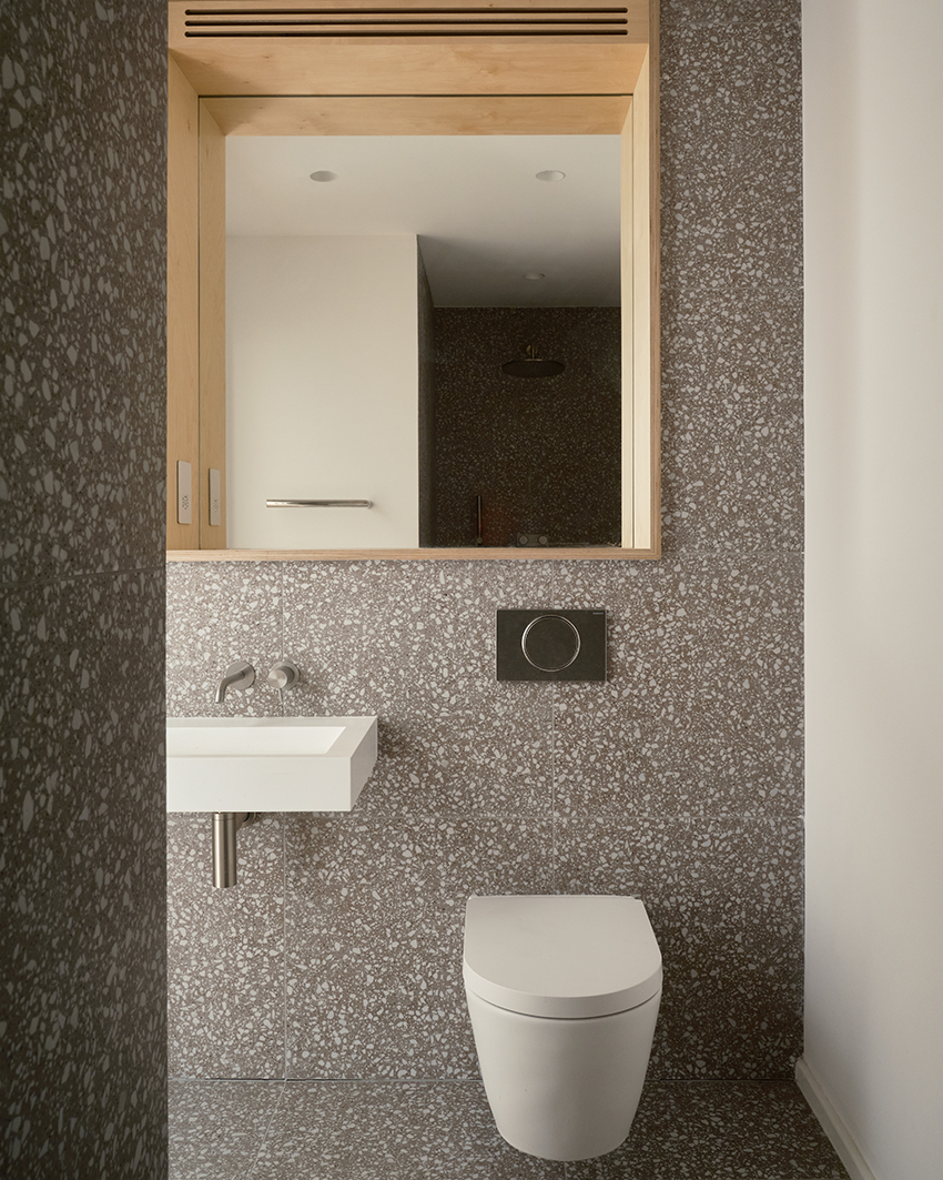 DROO covers residential unit's protruding volumes in textured brickwork in london