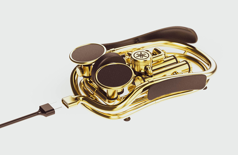 two yamahas, one passion' poses saxophone-shaped hand gripper