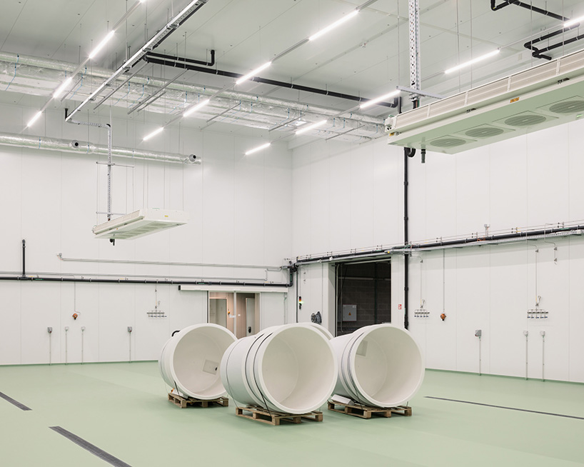 blue glass mosaic overlays maritime scientific research building in belgium