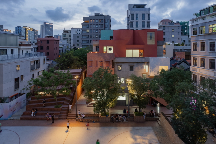 colorful geometric volumes by URBANUS extend atop old building in china
