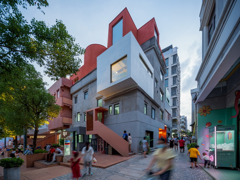 colorful geometric volumes by URBANUS extend atop old building in china