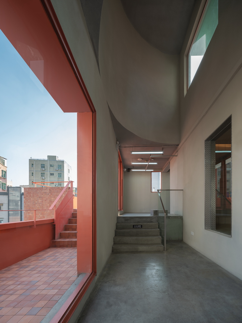 colorful geometric volumes by URBANUS extend atop old building in china