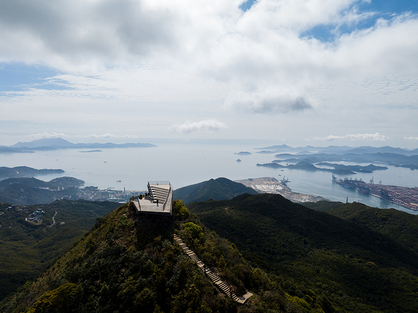 meishajian urban viewing platform by line+ resembles stone boulder on shenzhen’s mountain