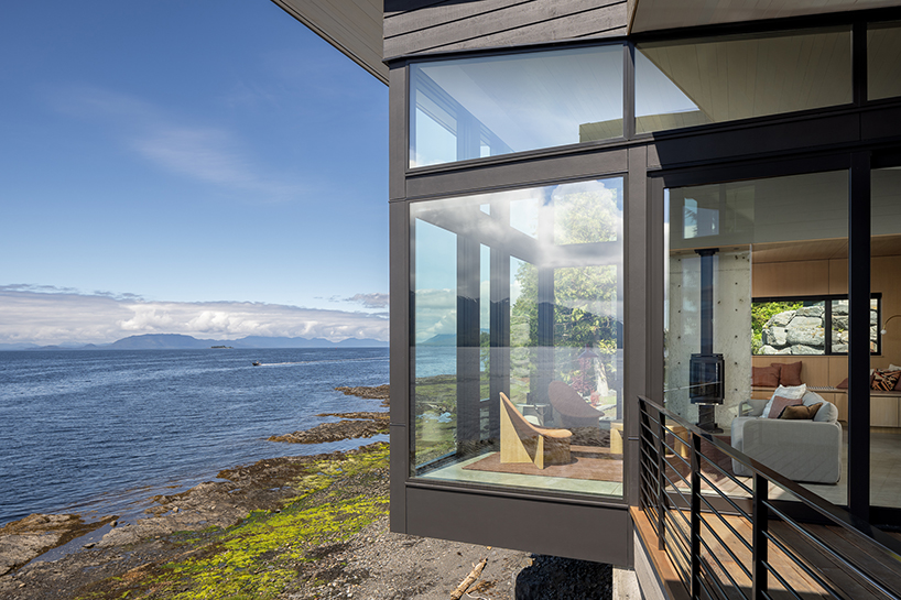 intimate glazed observatory gently perches over the alaskan shore