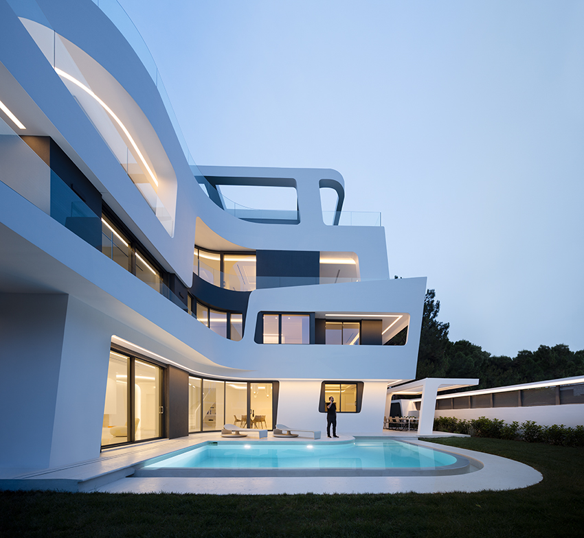 sculptural ribbon-like volumes compose dual residence by direction architects in athens