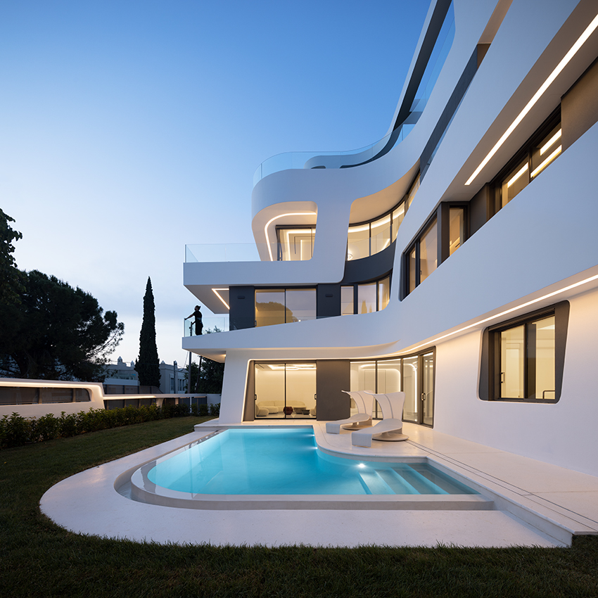 sculptural ribbon-like volumes compose dual residence by direction architects in athens