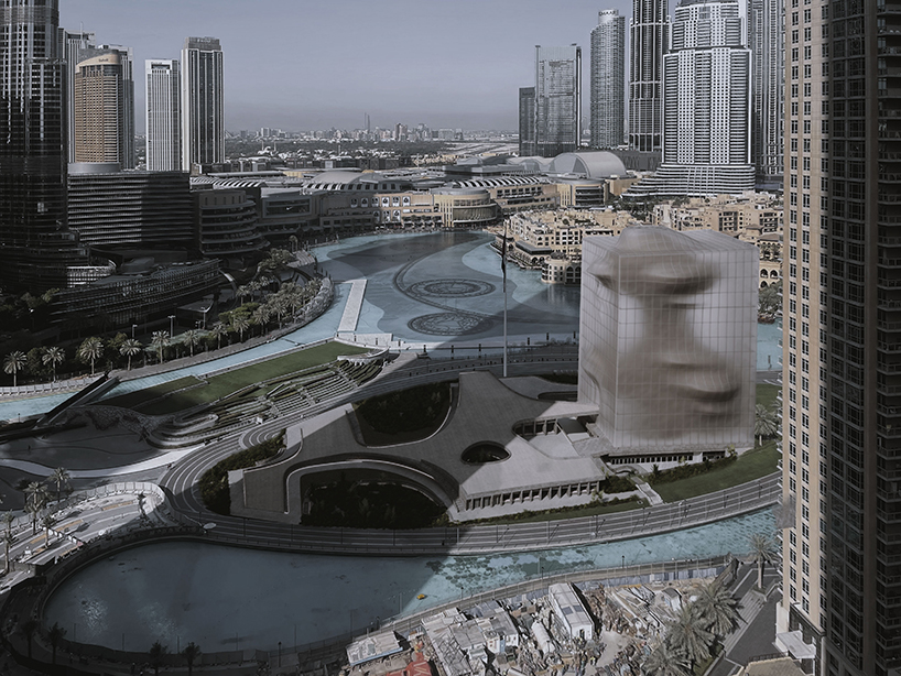 semi-transparent membrane wraps the sculptural body of dubai art museum