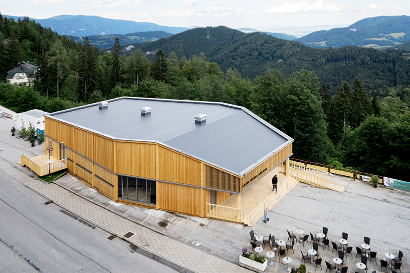 regional larch wood makes up sustainable mobile concert hall in austrian hillside