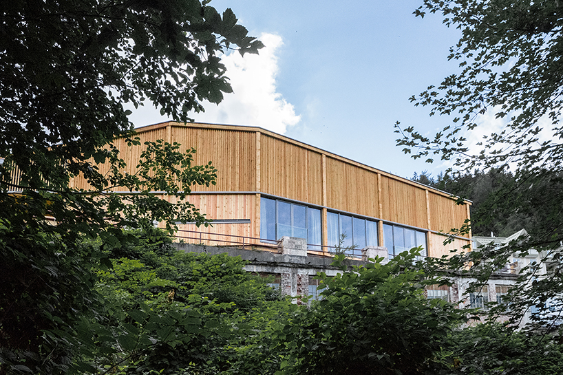 regional larch wood makes up sustainable mobile concert hall in austrian hillside