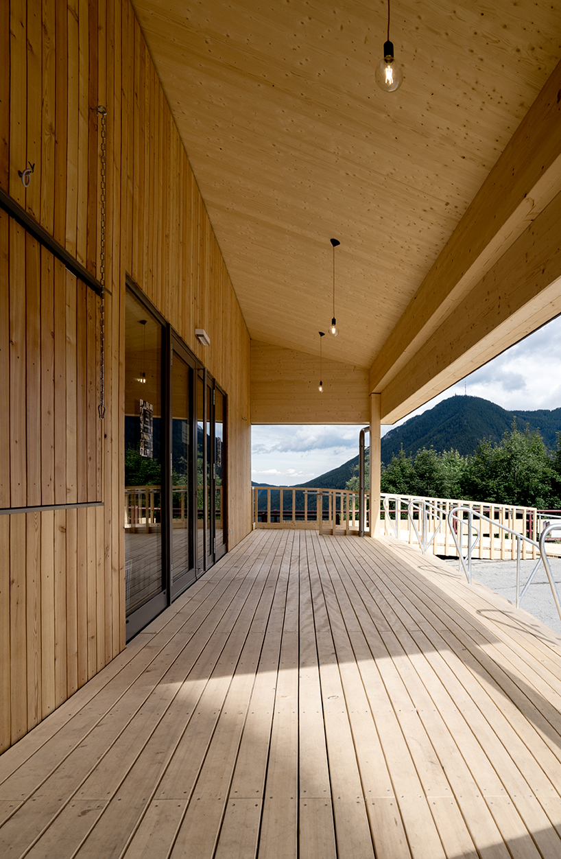 regional larch wood makes up sustainable mobile concert hall in austrian hillside