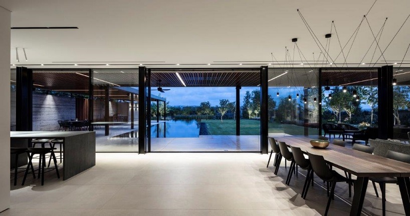 L shaped house in Israel opens to a spacious lush garden