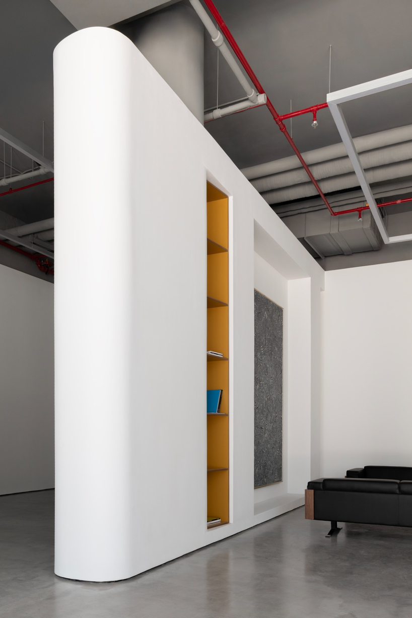 dubai gallery pairs open white exhibition halls with a concealed, brick-toned museum room - 8