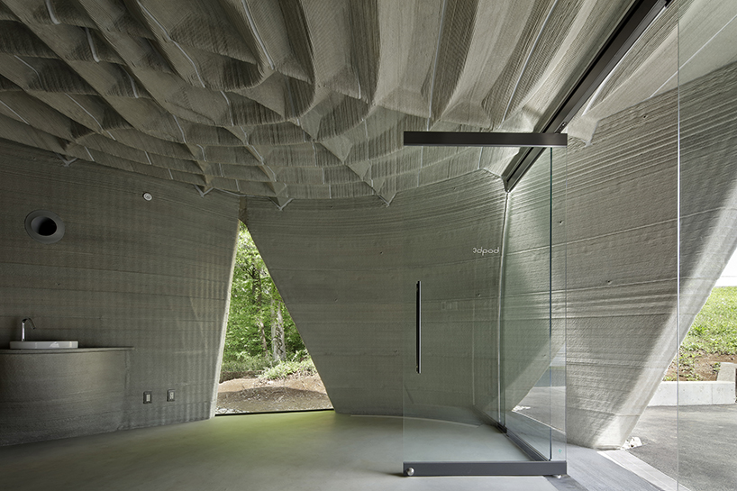 spiral staircase wraps around the sculptural 3D-printed body of 3dpod in tokyo