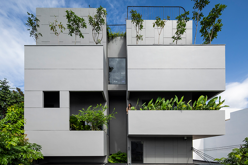 pham huu son weaves small green gardens throughout this sustainable home in vietnam