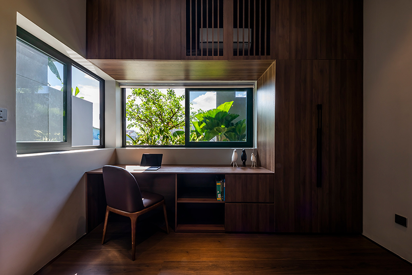 pham huu son weaves small green gardens throughout this sustainable home in vietnam