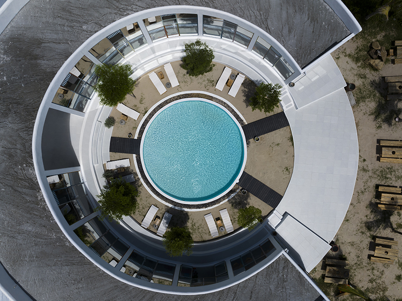 pham huu son renders mediterranean-style beach resort in vietnam in white lime