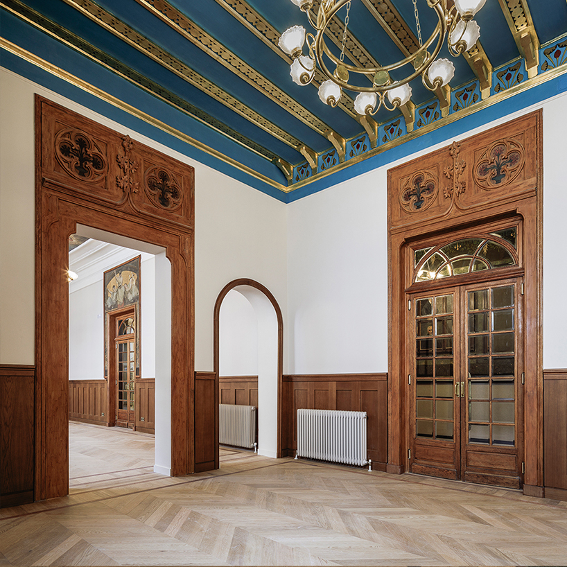 old and new intertwine with oak wood expressions for the restoration of historic ateneo de madrid