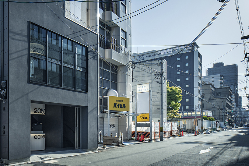 diagonal forms and illuminated curves outline 2050 coffee shop along osaka’s midosuji axis - 1
