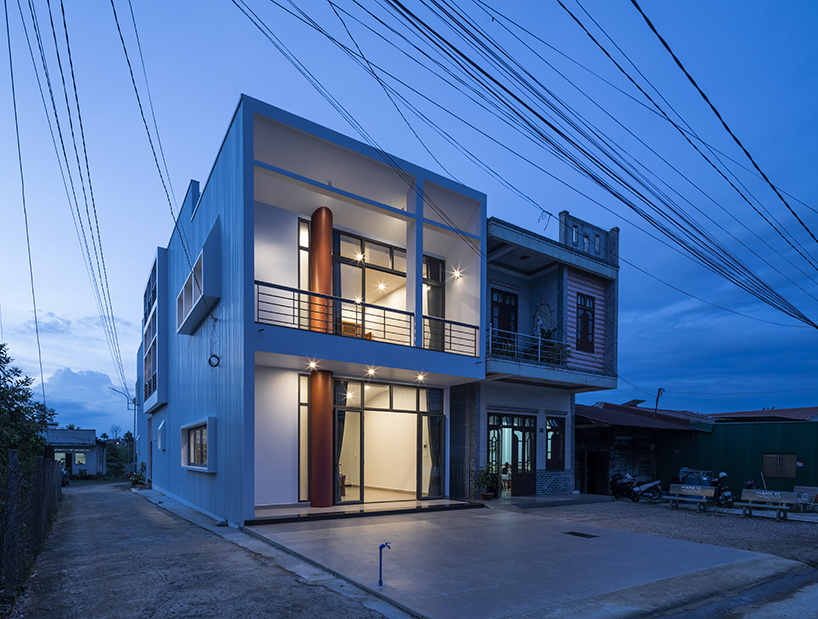 two ample voids afford openness and interaction for family house in vietnam