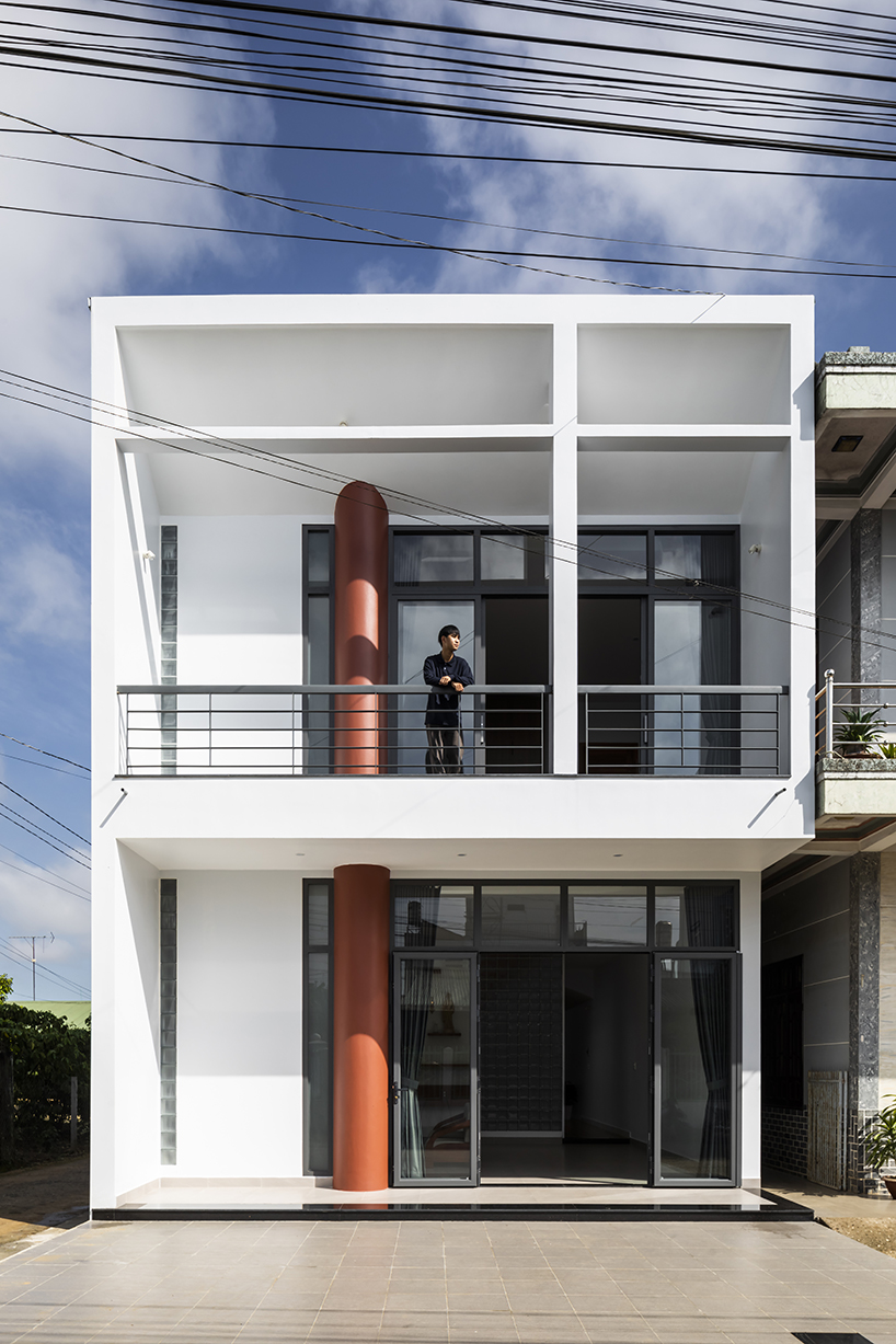 two ample voids afford openness and interaction for family house in vietnam