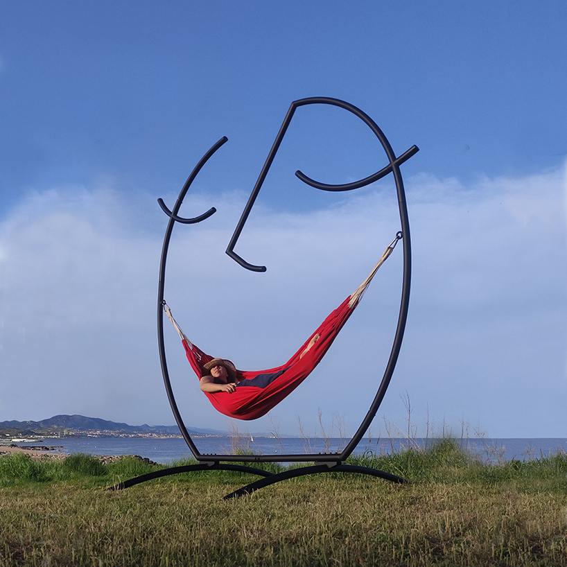 federica sala's smiling 'happy hammock' sculpture cradles the inner child