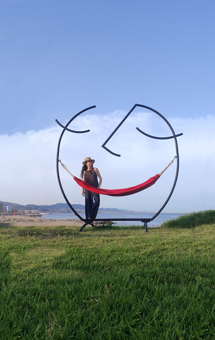 federica sala's smiling 'happy hammock' sculpture cradles the inner child
