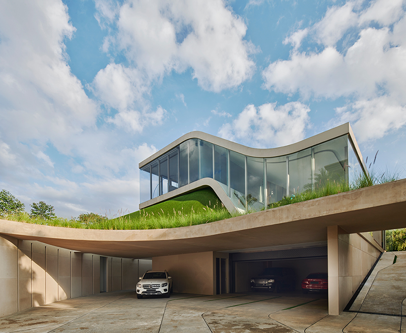 ripple-shaped family house in indonesia adapts to feng shui for optimal living