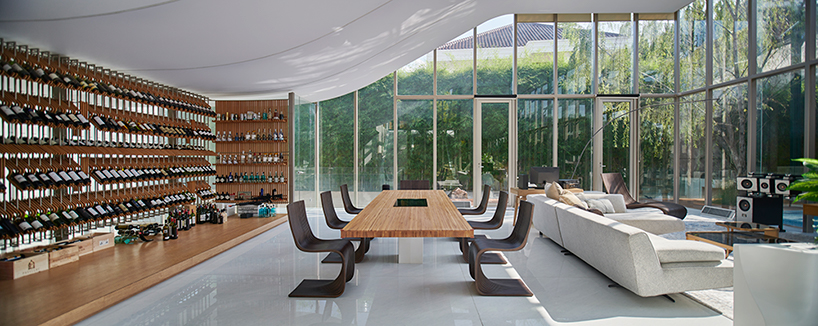 ripple-shaped family house in indonesia adapts to feng shui for optimal living