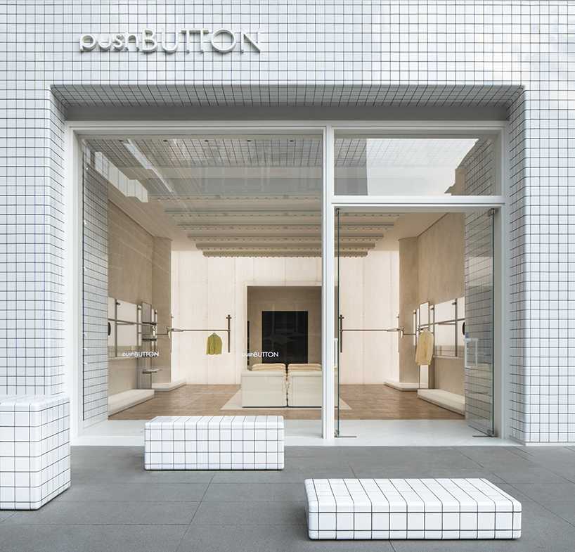 fei design's pushBUTTON store in china is wrapped in a monochrome geometric facade