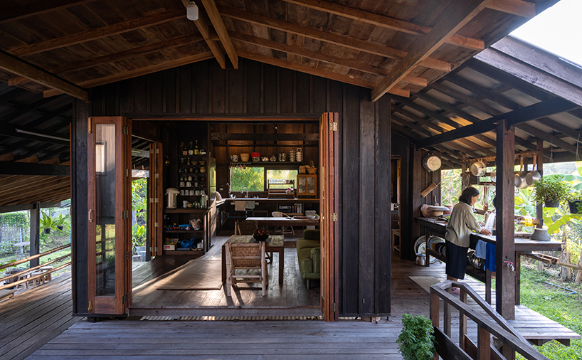 local wood joinery technique assembles roofed residence in northern thailand