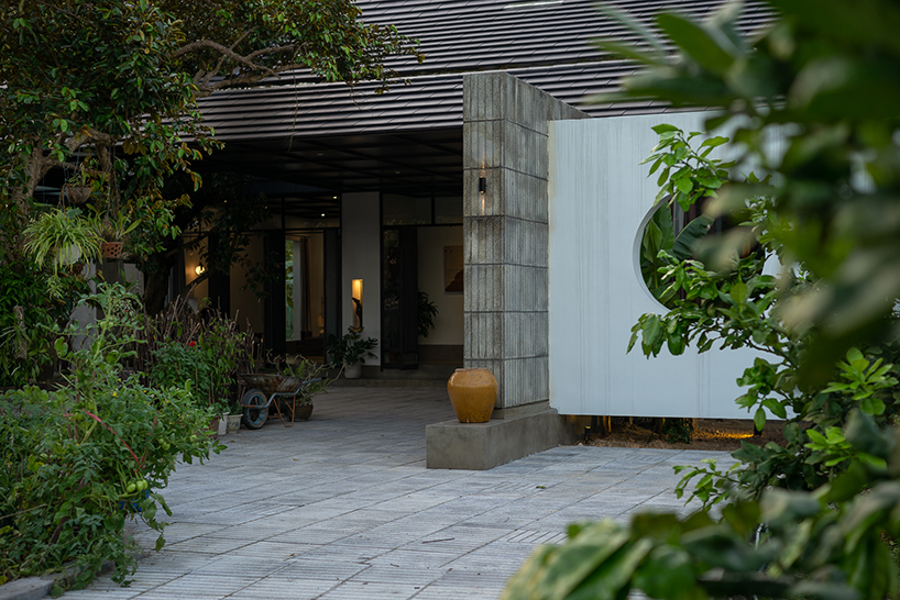 cement blocks and iron lattice enclose private courtyard in rural vietnam