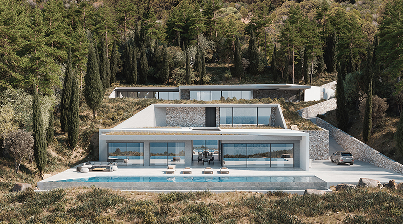 façade’s morphological villa is composed of white prisms wedged into the cliffs of lefkada