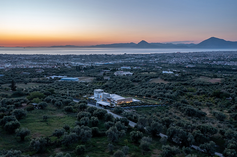 interior and exterior merge within façade studio's geometric panorama residence in greece