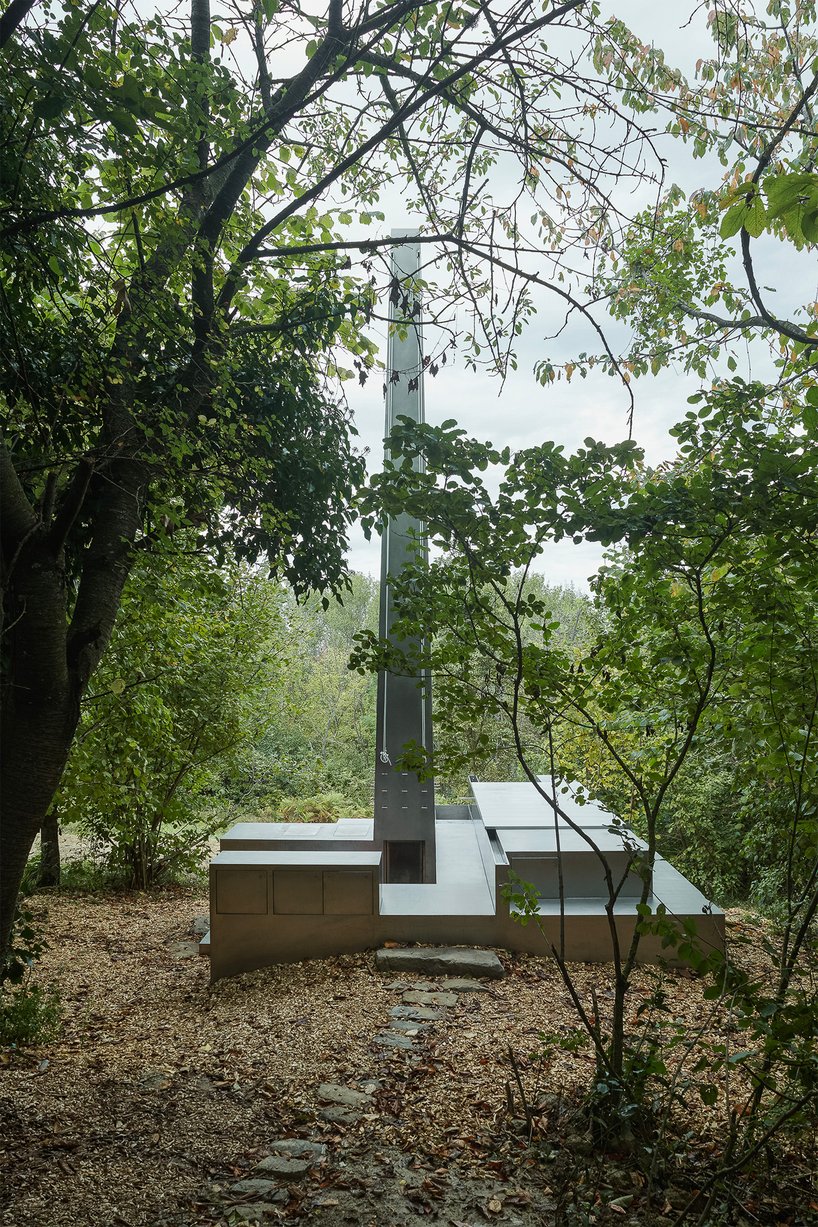 carrocerra collective's open-air steel house in italian forest reimagines ritualistic living
