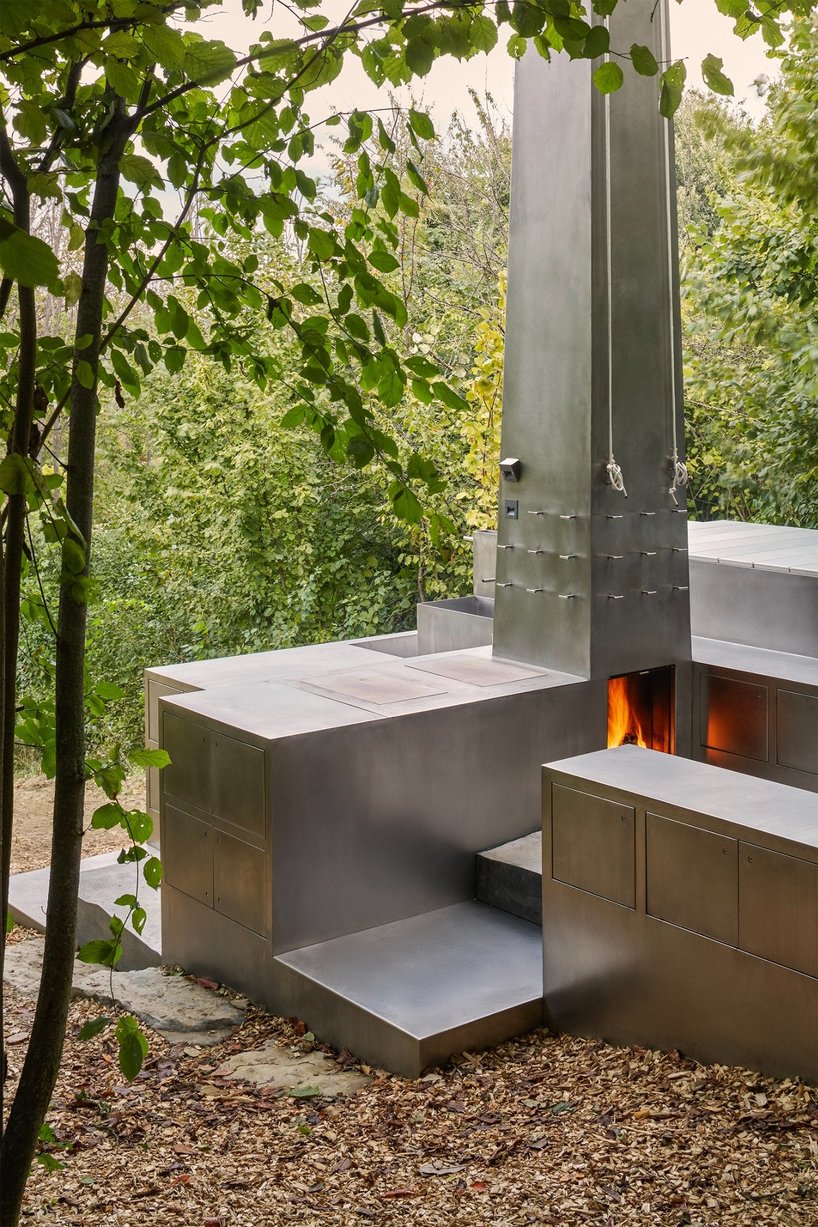 carrocerra collective's open-air steel house in italian forest reimagines ritualistic living