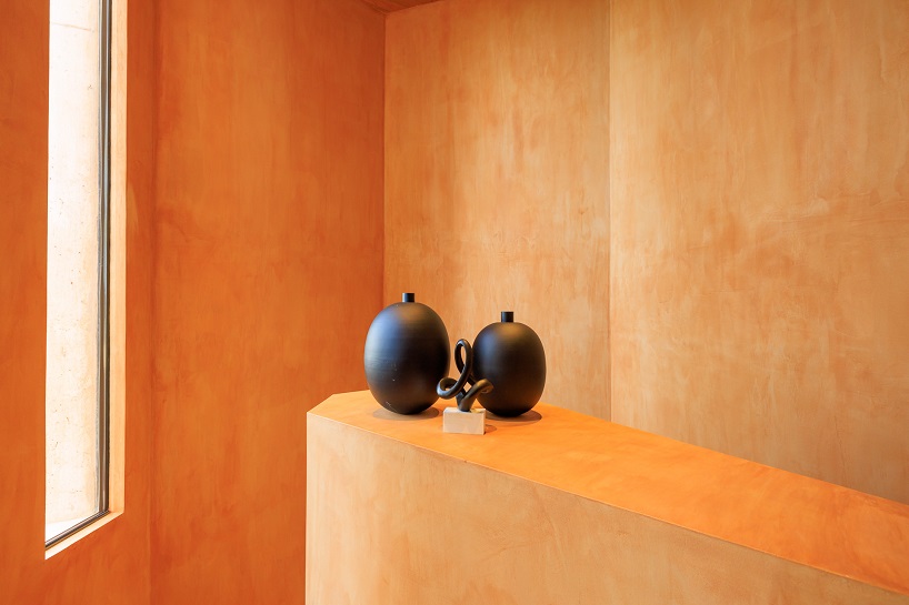 RCR arquitectes’ red concrete resort villa echoes the sandy hues and textures of the algarve