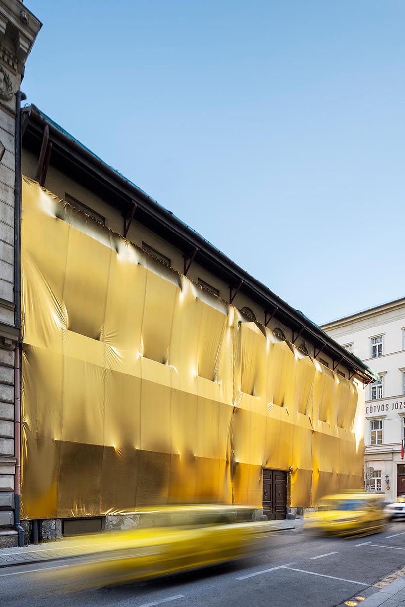 19th century palaces in budapest wrapped in golden fabric 5