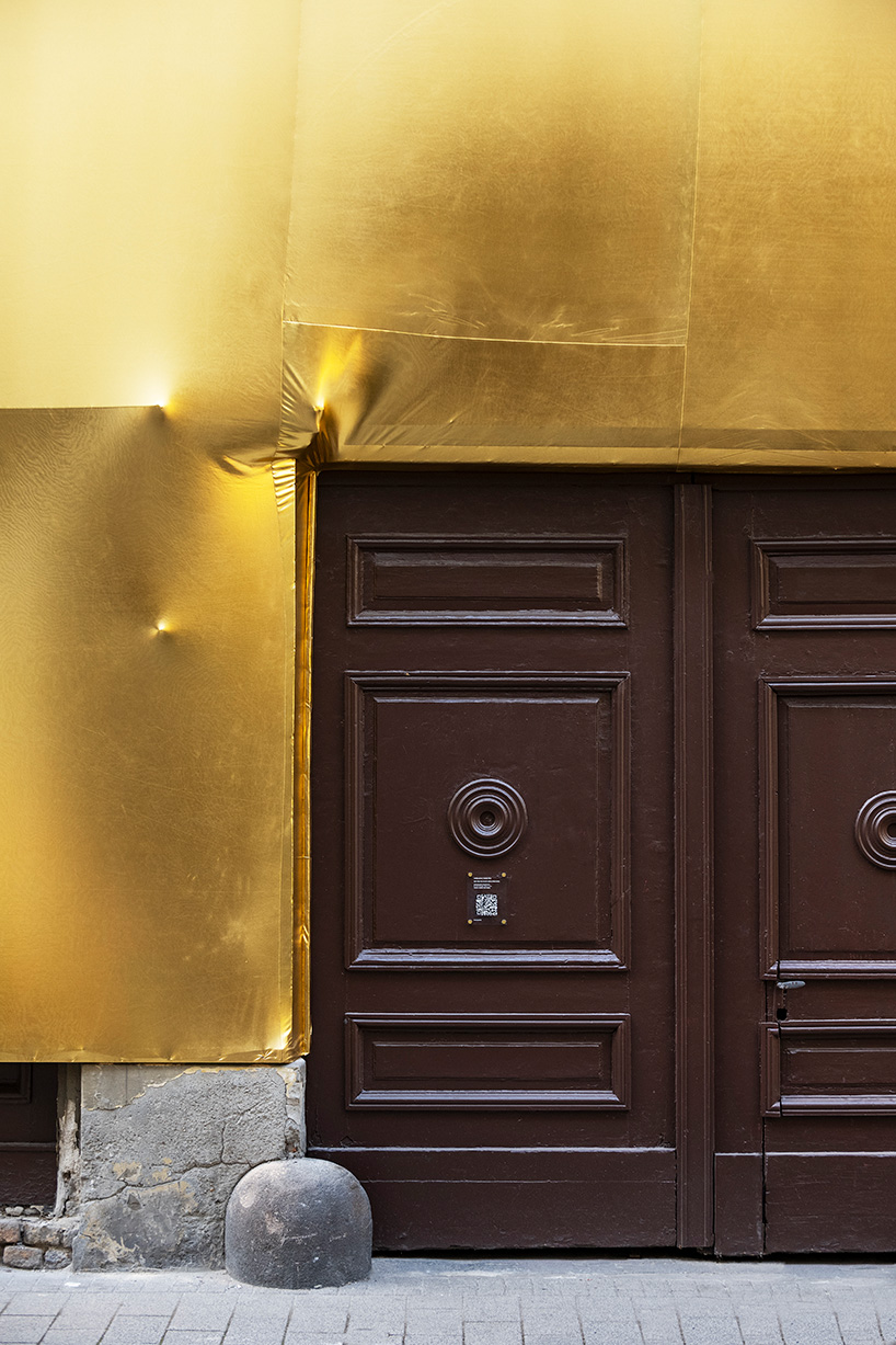 19th century palaces in budapest wrapped in golden fabric 6