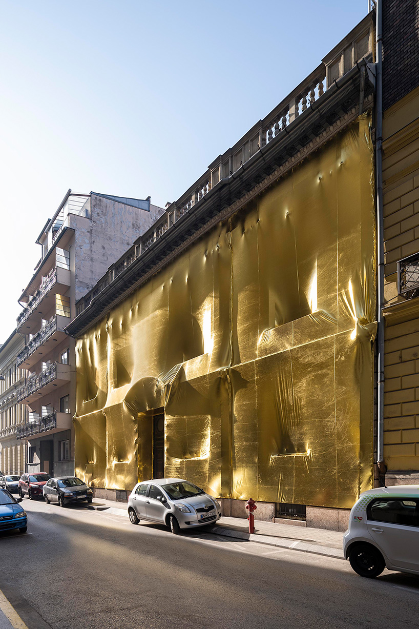 19th century palaces in budapest wrapped in golden fabric 9