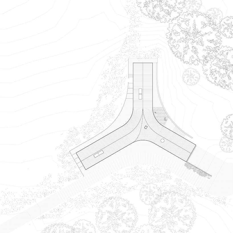 estudio esmero clads y-shaped home in new york meadow with shou sugi ban cedar siding