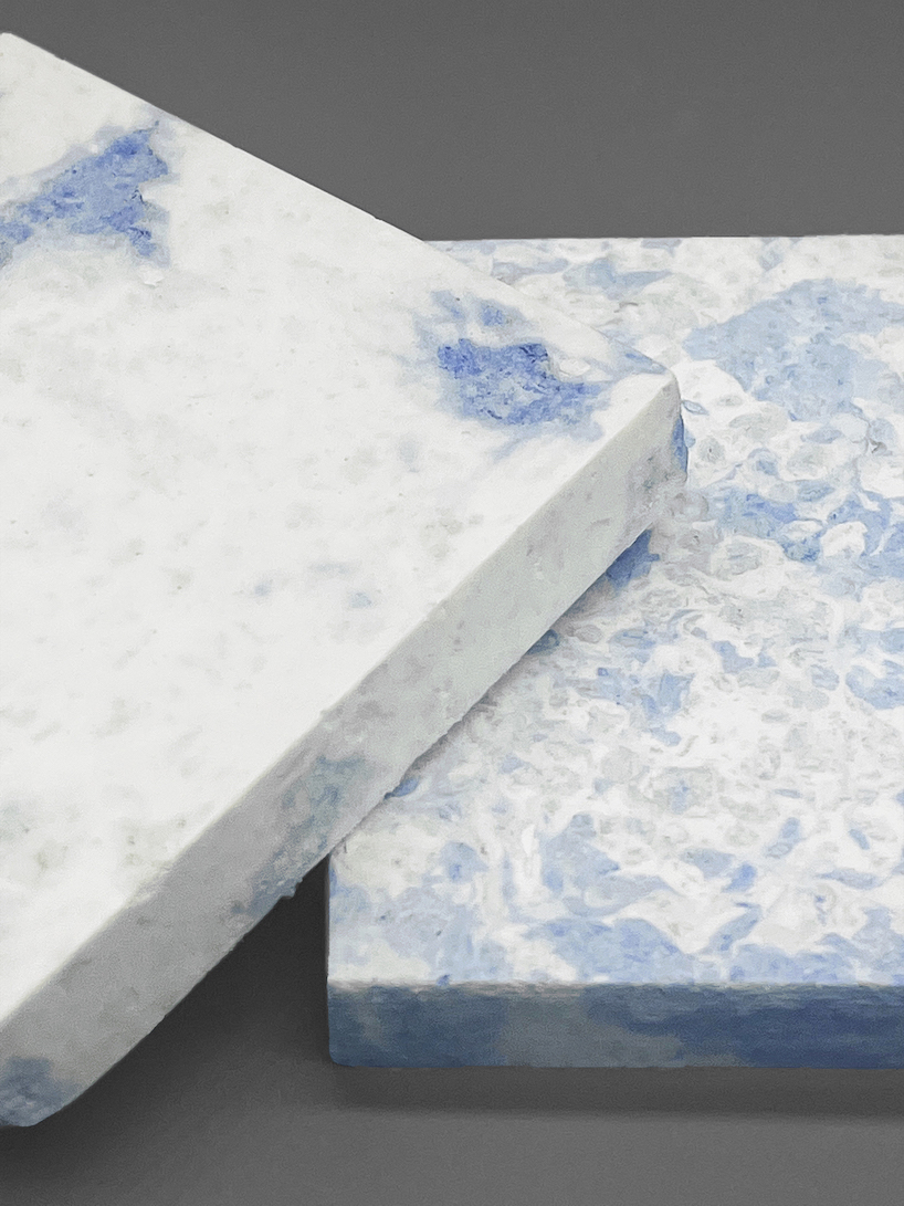 design an mor recycles industrial waste paper into modular furniture with a marble surface