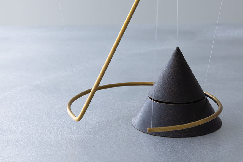 so koizumi's brass wind chime explores human emotion with delicate tensegrity structure