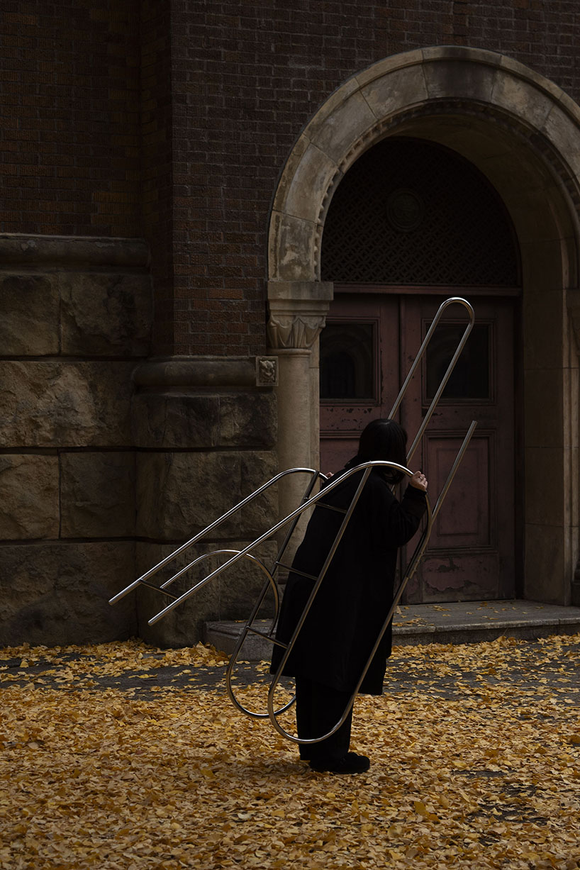 sculptural steel ladder imitates the flowing geometries of brass musical instruments - 8