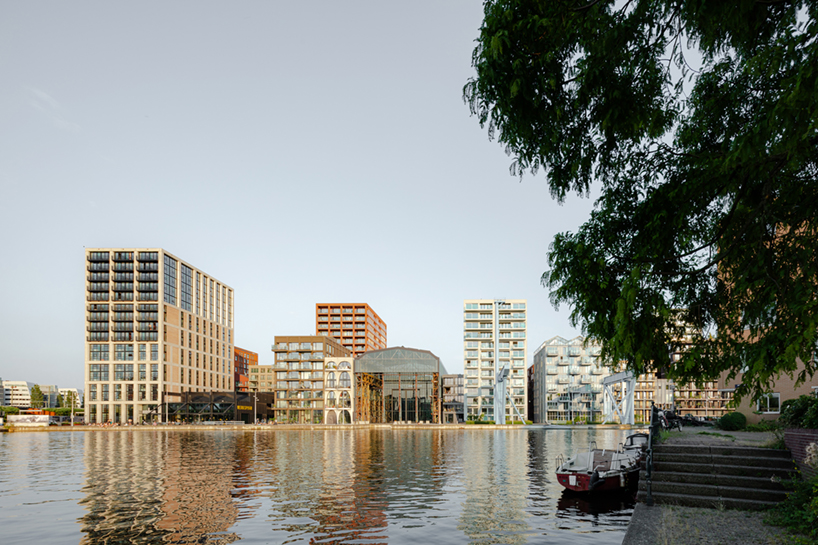 studioninedots' oostenburg island replan blends industrial heritage with urban density