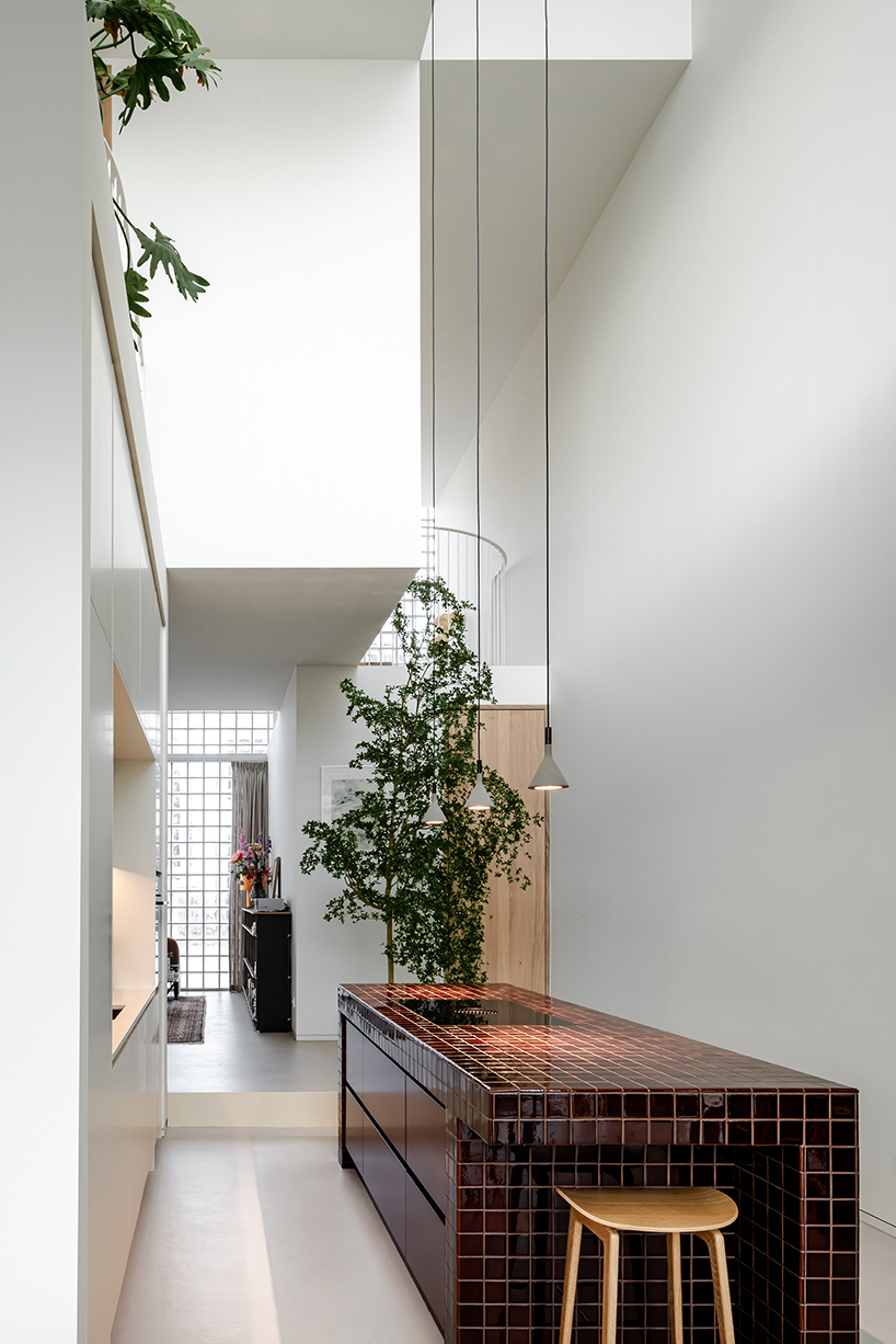 glass block facade wraps studioninedots’ playfully stacked box residence in amsterdam - 7