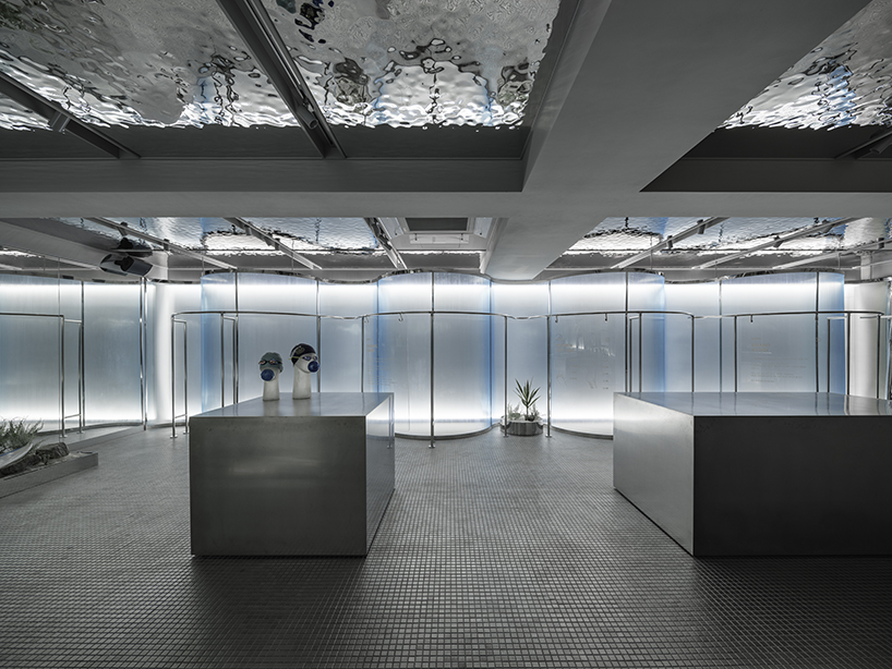 steel interiors ripple like waves in niiiz design lab's korean swimwear store