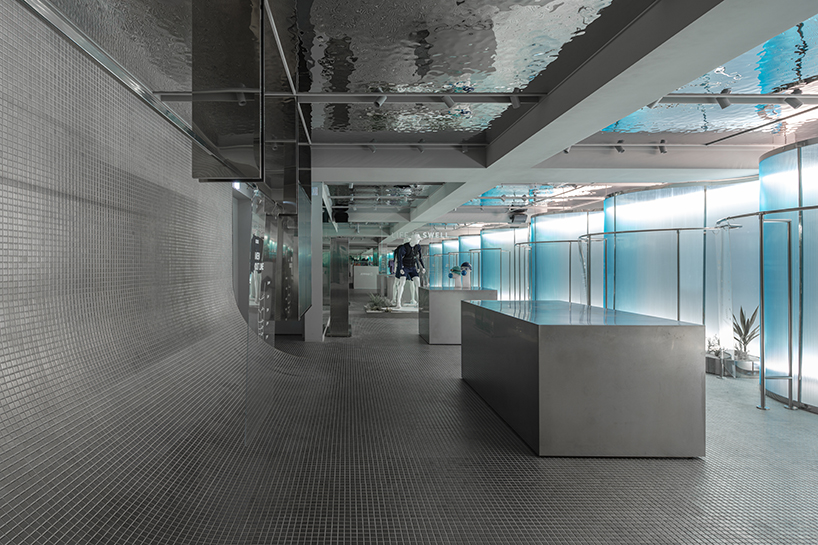 steel interiors ripple like waves in niiiz design lab's korean swimwear store